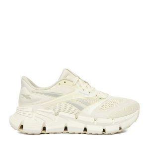 Buty do biegania Reebok. Białe buty sportowe Reebok, bez wzorów, bez zapięcia, do biegania. Za 489,99 zł.