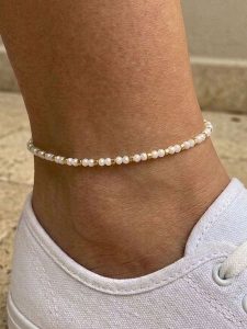 Lodie Silver Bransoletka z elementami ozdobnymi na kostkę rozmiar: onesize. Białe bransoletki Lodie Silver, metalowe. Za 30,45 zł.