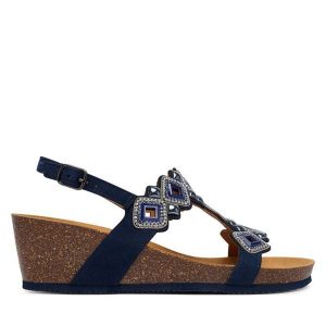 Sandały Scholl. Niebieskie sandały Scholl, bez wzorów, bez obcasa, na koturnie, bez zapięcia. Za 449,99 zł.