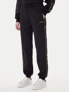 Guess Spodnie dresowe V5BB23 KCX22 Czarny Wide Leg. Czarne spodnie dresowe Guess, xl, z aplikacjami, z dresówki. Za 479,99 zł.