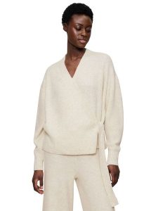 Triumph Kardigan "Amourette" w kolorze beżowym rozmiar: 44. Brązowe swetry oversize Triumph, bez wzorów, ze splotem, bez ramiączek. Za 110,29 zł.