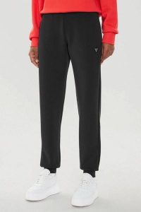 GUESS Czarne damskie spodnie dresowe Olympe, Rozmiar L. Czarne spodnie dresowe Guess, l, z aplikacjami, z dresówki. W wyprzedaży za 227,99 zł.