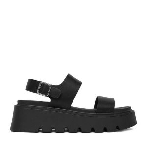 Sandały JENNY. Czarne sandały Jenny, bez wzorów, bez obcasa, na płaskiej podeszwie, bez zapięcia. Za 129,99 zł.