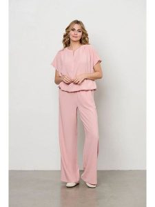 &Co Woman Spodnie "Nelly" w kolorze jasnoróżowym rozmiar: L. Różowe spodnie z wysokim stanem &Co Woman, bez wzorów, z materiału, z podwyższonym stanem. Za 130,50 zł.