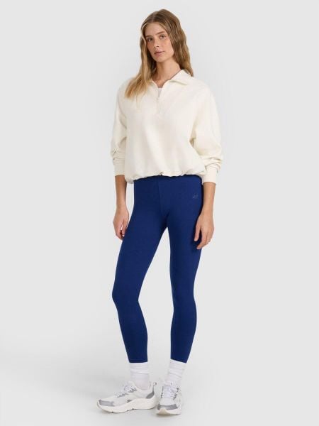Legginsy fitness damskie z wysokim stanem. Niebieskie legginsy 4f, bez wzorów, z bawełny, z podwyższonym stanem, długie. Za 64,11 zł.