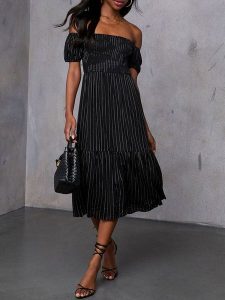 Milan Kiss Sukienka w kolorze czarnym rozmiar: M. Czarne sukienki Milan Kiss, m, bez wzorów, z wiskozy, bez kołnierzyka, bez ramiączek, midi. Za 165,99 zł.