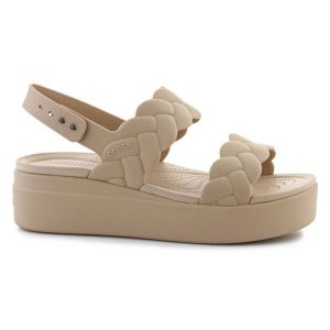 Sandały Crocs Brooklyn Woven Low Wedge 209977-212 beżowy. Brązowe sandały bez wzorów, bez obcasa, na koturnie, bez zapięcia. Za 367,32 zł.