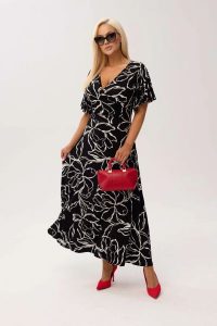 Sukienka kopertowa Valencia Mono MAXI z falującym rękawem i kobiecym dekoltem PLUS SIZE XXL OVERSIZE WIOSNA LATO. Białe sukienki Moda Size Plus Iwanek, na co dzień, na lato, plus size, bez wzorów, z elastanu, eleganckie, bez kołnierzyka, plus size, bez ramiączek, maxi, kopertowe. Za 359,90 zł.