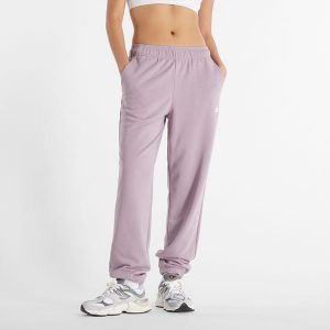 Spodnie damskie New Balance WP41500ICW – różowe. Czerwone spodnie z wysokim stanem New Balance, bez wzorów, z bawełny, z podwyższonym stanem. Za 129,99 zł.