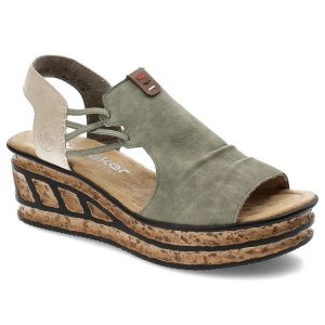 Zielone Sandały Rieker Modne Obuwie Damskie. Zielone sandały Rieker, bez wzorów, ze skóry, bez obcasa, na koturnie, bez zapięcia. Za 287,90 zł.