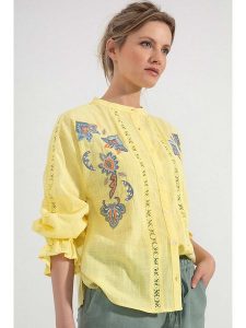 Josephine & Co Bluzka w kolorze żółtym rozmiar: 42. Żółte bluzki Josephine & Co, bez wzorów, z bawełny, bez kołnierzyka, bez ramiączek. Za 198,56 zł.