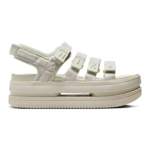 Sandały Nike Icon Classic Se FJ2595-002 beżowy. Brązowe sandały bez wzorów, bez obcasa, bez zapięcia. Za 406,54 zł.