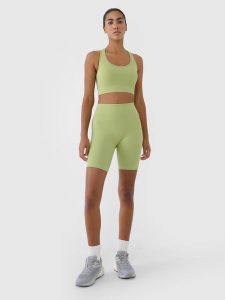 4F Legginsy kolarki bezszwowe treningowe damskie - zielone XS/S. Zielone legginsy 4f, bez wzorów, z dzianiny, z podwyższonym stanem, krótkie. W wyprzedaży za 59,99 zł.