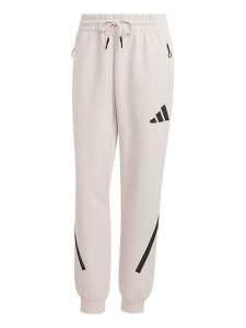 Adidas Spodnie dresowe "Z.N.E." w kolorze kremowym rozmiar: S. Brązowe spodnie dresowe ADIDAS, s, bez wzorów, z dresówki. Za 134,85 zł.