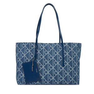 Torebka Calvin Klein. Niebieskie shopper bag Calvin Klein, bez wzorów, z denimu, bez dodatków. Za 649,99 zł.