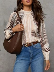 Milan Kiss Bluzka w kolorze kremowo-brązowym rozmiar: XL. Brązowe bluzki Milan Kiss, xl, bez wzorów, bez kołnierzyka, bez ramiączek. Za 152,99 zł.