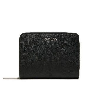Portfel Calvin Klein. Czarne portfele Calvin Klein, bez wzorów. Za 159,99 zł.