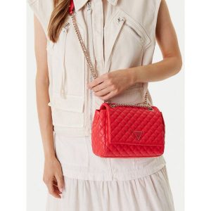 Torebka Guess. Pomarańczowe torebki wieczorowe Guess, z aplikacjami, bez dodatków. Za 299,99 zł.
