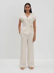 Someday Spodnie "Cevil" w kolorze kremowym rozmiar: 34. Brązowe spodnie z wysokim stanem someday., bez wzorów, z materiału, z podwyższonym stanem. Za 165,99 zł.