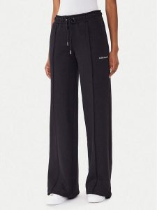 Guess Jeans Spodnie dresowe W5BB04 KC811 Czarny Wide Leg. Czarne spodnie dresowe Guess Jeans, l, z aplikacjami, z bawełny. Za 249,99 zł.