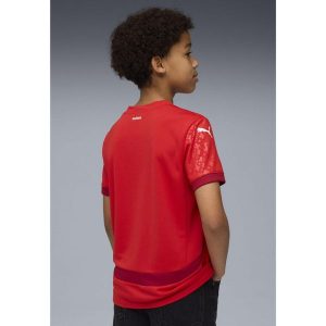 Młodzieżowa koszulka domowa kobiecej reprezentacji Szwajcarii Team 2025 PUMA. Czerwona bluzki Puma, m, bez wzorów, młodzieżowe, bez kołnierzyka, bez ramiączek. Za 309,00 zł.