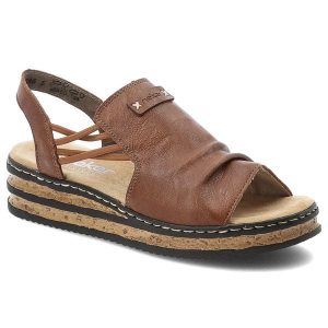 Sandały damskie Rieker, cholewka ze skóry ekologicznej elastyczne paski z tyłu na płaskiej podeszwie, brązowe, 62962-22. Brązowe sandały Rieker, bez wzorów, ze skóry ekologicznej, bez obcasa, na koturnie, bez zapięcia. Za 299,00 zł.