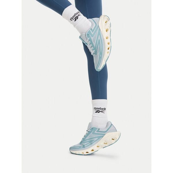 Buty do biegania Reebok. Niebieskie buty sportowe Reebok, bez wzorów, bez zapięcia, do biegania. Za 349,99 zł.