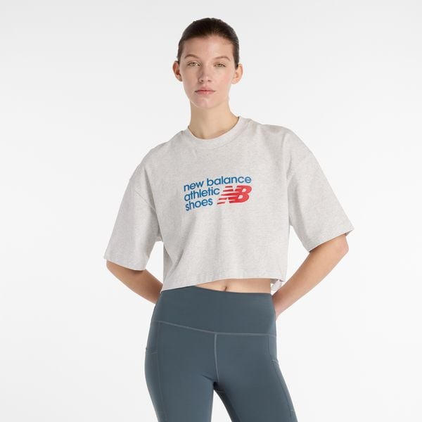 Koszulka damska New Balance WT51908AHH – szara. Szare bluzki New Balance, s, bez wzorów, z bawełny, bez kołnierzyka, bez ramiączek. Za 169,99 zł.