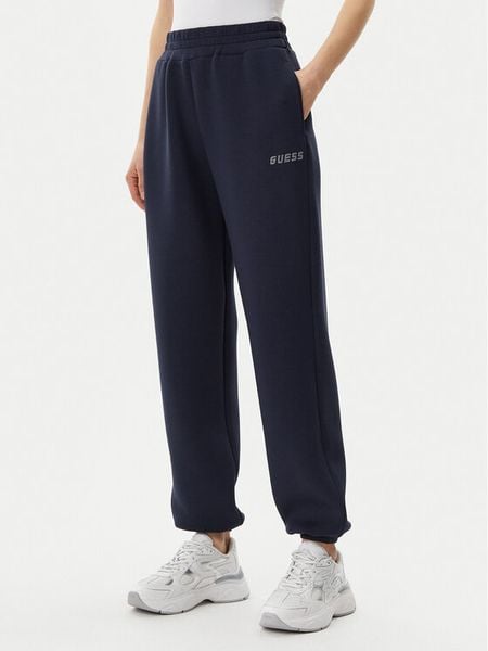 Guess Spodnie dresowe V4BB13 K7UW2 Granatowy Regular Fit. Niebieskie spodnie dresowe Guess, xs, z aplikacjami, z dresówki. Za 189,99 zł.