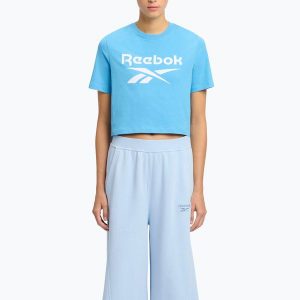 Koszulka Reebok Identity Big Logo Crop Tee. Niebieskie bluzki REEBOK FITNESS, bez wzorów, sportowe, bez kołnierzyka, bez ramiączek. Za 69,99 zł.
