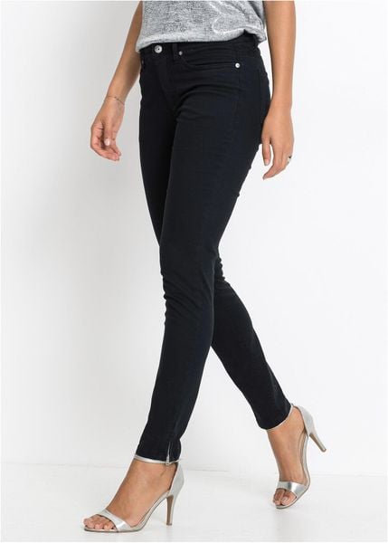 Jeansy skinny, mid waist, cropped. Czarne jeansy bonprix, bez wzorów, z jeansu. Za 142,99 zł.
