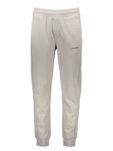 Calvin Klein Spodnie dresowe w kolorze kremowym rozmiar: M. Brązowe spodnie dresowe Calvin Klein, m, bez wzorów, z bawełny. Za 239,99 zł.