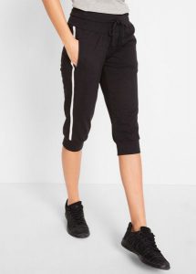 Spodnie sportowe 3/4 z bawełny. Czarne spodnie dresowe bonprix, bez wzorów, z bawełny. Za 92,99 zł.