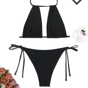 Dwuczęściowy strój kąpielowy z regulowanym topem na plażę lub basen Maribel. Białe bikini Intica, bez wzorów, z materiału. Za 139,00 zł.