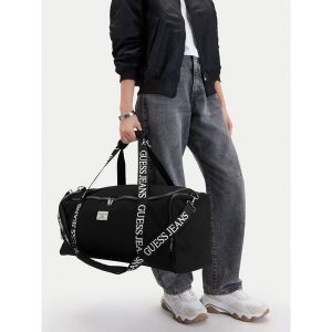 Torba weekendowa Guess Jeans. Czarne torby podróżne i sportowe Guess Jeans, z aplikacjami, z jeansu. Za 299,99 zł.