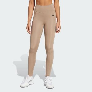 Długie legginsy Optimé Essentials Stash Pocket. Brązowe legginsy ADIDAS, bez wzorów, z elastanu, z podwyższonym stanem, długie. Za 204,20 zł.