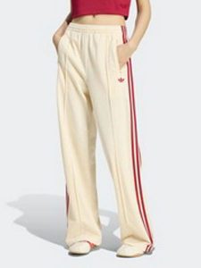 Adidas Spodnie dresowe w kolorze kremowym rozmiar: M. Brązowe spodnie dresowe ADIDAS, m, bez wzorów, z dresówki. Za 209,95 zł.