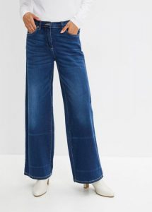 Jeansy wide leg ze średnim stanem i wygodnym pasem. Niebieskie spodnie z wysokim stanem bonprix, bez wzorów, z jeansu. Za 159,99 zł.