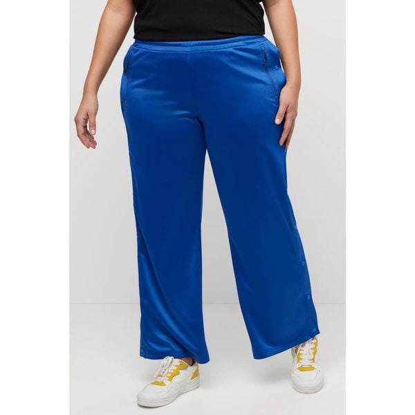 Damskie Spodnie joggingowe guziki szerokie nogawki materiał z recyklingu. Niebieskie spodnie dresowe Ulla Popken, plus size, bez wzorów, z materiału. Za 294,99 zł.