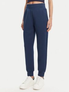 Guess Spodnie dresowe W5YB11 KBYE2 Granatowy Regular Fit. Niebieskie spodnie dresowe Guess, xl, z aplikacjami, z dresówki. Za 299,99 zł.