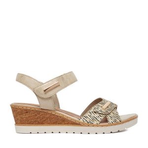 Sandały Remonte. Żółte sandały Remonte, bez wzorów, bez obcasa, na koturnie, bez zapięcia. Za 359,99 zł.