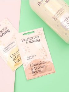 Balsam do ciała Sinsay x Perfecta - złoty. Żółte body i gorsety Sinsay, bez wzorów. W wyprzedaży za 2,49 zł.