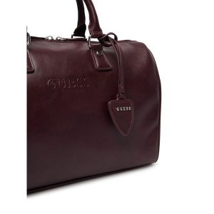 Torebka Guess. Fioletowe kuferki Guess, z aplikacjami, bez dodatków. Za 434,99 zł.