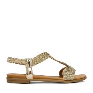 Sandały JENNY. Żółte sandały Jenny, bez wzorów, bez obcasa, na płaskiej podeszwie, bez zapięcia. Za 89,99 zł.