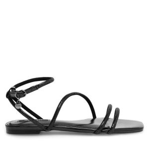 Sandały Nine West. Czarne sandały Nine West, bez wzorów, bez obcasa, na płaskiej podeszwie, bez zapięcia. Za 127,99 zł.