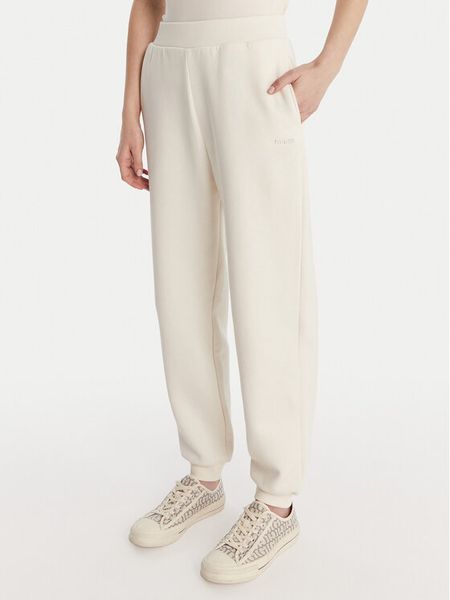 Guess Spodnie dresowe V6RB15 K9V31 Écru Regular Fit. Spodnie dresowe Guess, l, z aplikacjami, z bawełny. Za 299,99 zł.