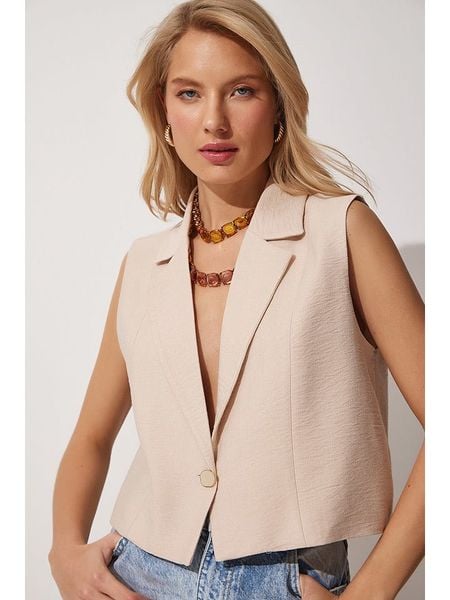 Happiness Istanbul Lniana kamizelka w kolorze beżowym rozmiar: 40. Brązowe kamizelki Happiness Istanbul, bez wzorów, ze lnu, bez kołnierzyka, bez ramiączek, bez kaptura. Za 82,83 zł.