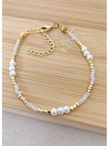 La Asena Pozłacana bransoletka rozmiar: onesize. Białe bransoletki La Asena, z perłą, pozłacane. Za 34,99 zł.