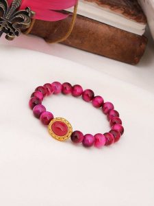 Pierres de Jade Pozłacana bransoletka z tygrysim okiem rozmiar: onesize. Różowe bransoletki Pierres de Jade, pozłacane. Za 43,99 zł.