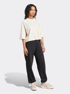 Adidas Spodnie dresowe w kolorze czarnym rozmiar: L. Czarne spodnie dresowe ADIDAS, l, bez wzorów, z bawełny. Za 175,67 zł.